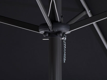Black 15ft double patio umbrella with sturdy metal frame, UV-resistant fabric, and crank lift system, providing ample shade for outdoor seating areas. Ideal for large patios and garden spaces.