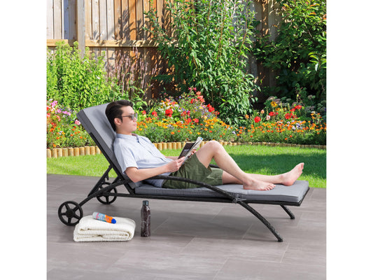 Black and grey outdoor wicker lounge chair with cushioned seat and backrest, featuring durable weather-resistant materials, sleek modern design, and ergonomic armrests for comfortable patio relaxation.