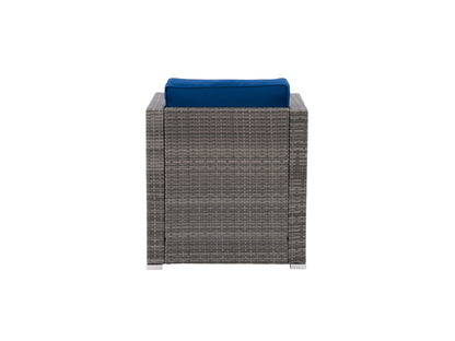 Natural wicker patio armchair with beige cushions, featuring a curved backrest and armrests, designed for outdoor comfort and style. The chair's woven texture and sturdy frame enhance durability and aesthetic appeal.