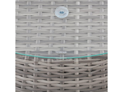 Wicker coffee table with round glass top, natural brown woven wicker base, and sturdy construction, perfect for outdoor patio use.