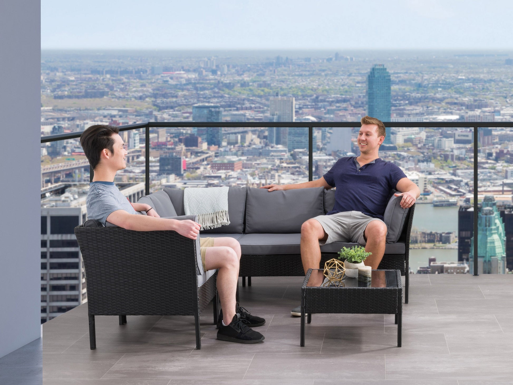 Black and grey 6-piece patio sectional set with weather-resistant cushions, modular design, and sleek metal frame. Ideal for outdoor lounging and entertaining.