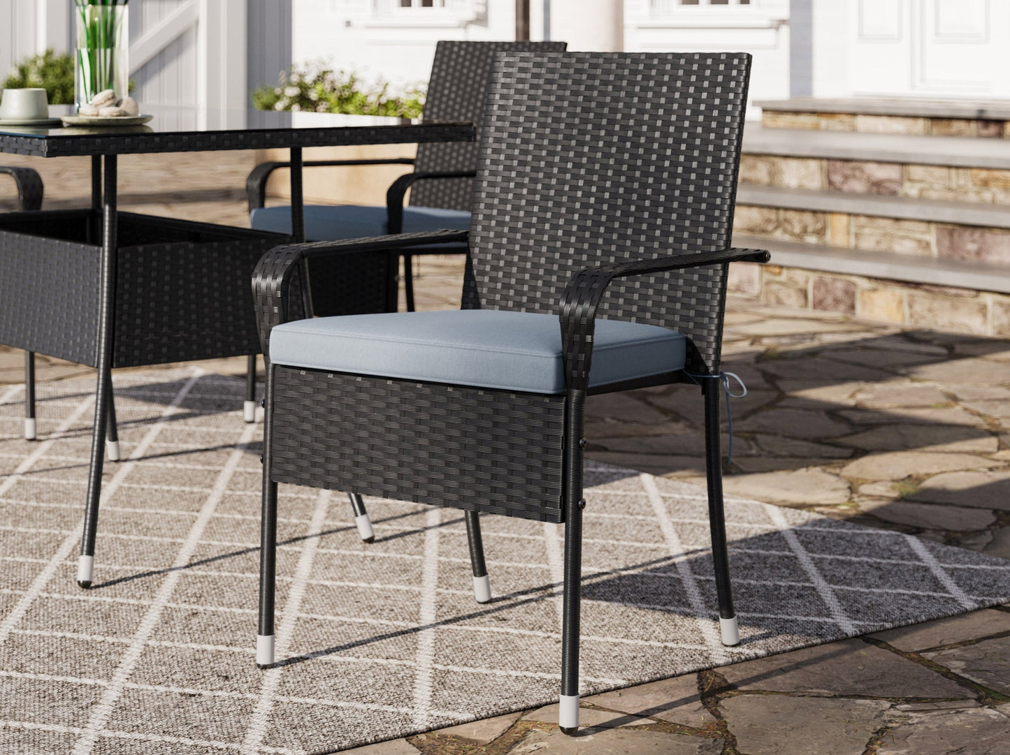 Modern 5-piece patio dining set with a rectangular glass table and four cushioned chairs in beige and brown wicker, featuring weather-resistant materials and a sleek design perfect for outdoor spaces.