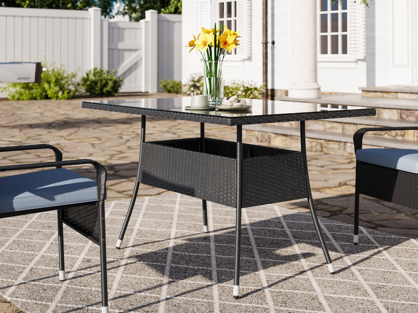 Modern 5-piece patio dining set with a rectangular glass table and four cushioned chairs in beige and brown wicker, featuring weather-resistant materials and a sleek design perfect for outdoor spaces.