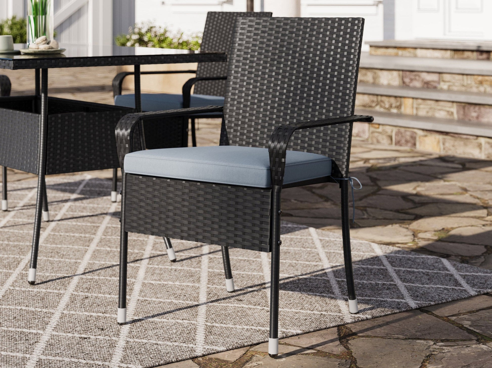 Modern 5-piece patio dining set with a rectangular glass table and four cushioned chairs in beige and brown wicker, featuring weather-resistant materials and a sleek design perfect for outdoor spaces.