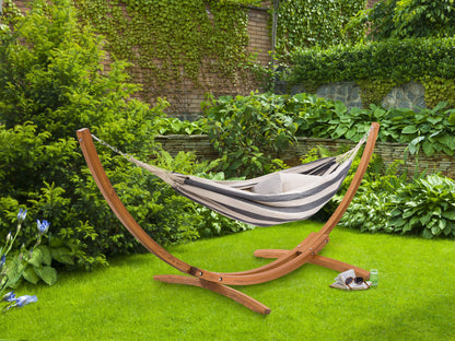 Navy blue and white striped patio hammock with wooden stand, featuring durable cotton fabric and sturdy, weather-resistant wood frame, perfect for outdoor relaxation and garden lounging.