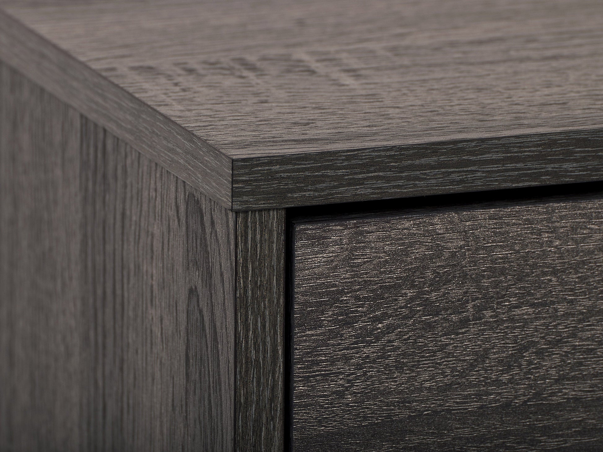 Dark grey TV stand with cabinet storage, suitable for TVs up to 85 inches, featuring sleek lines, modern design, and ample storage space with multiple compartments and shelves.