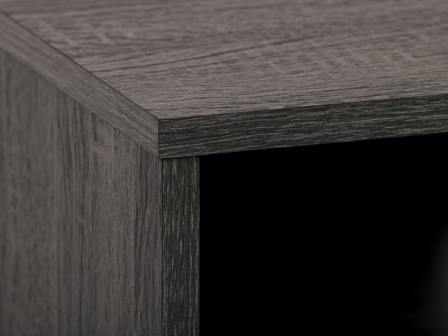 Dark grey TV bench with open shelves, suitable for TVs up to 85 inches. Features sleek, modern design with ample storage space for media devices, books, and decor. Durable wood construction with smooth finish.
