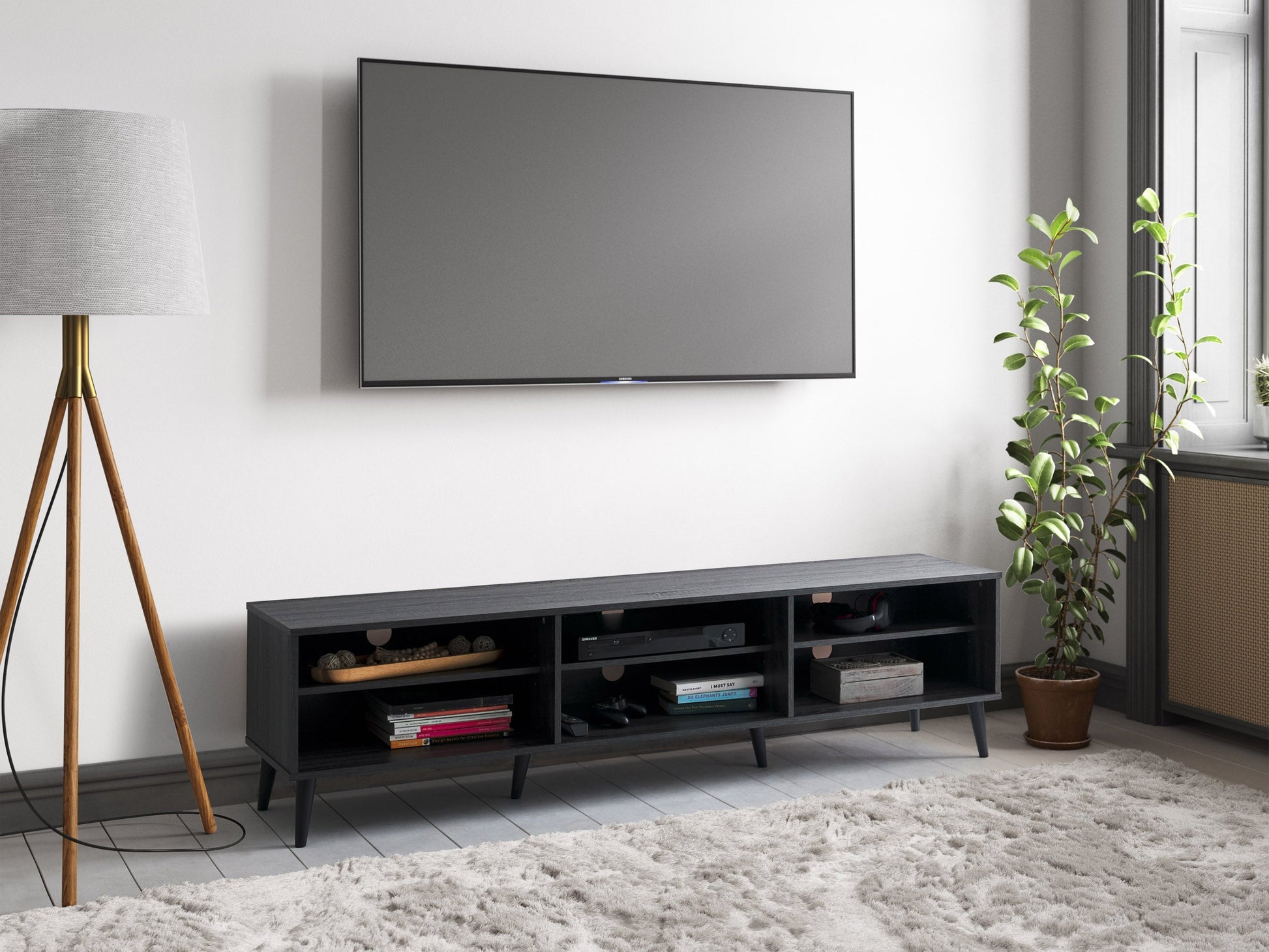 Dark grey TV bench with open shelves, suitable for TVs up to 85 inches. Features sleek, modern design with ample storage space for media devices, books, and decor. Durable wood construction with smooth finish.