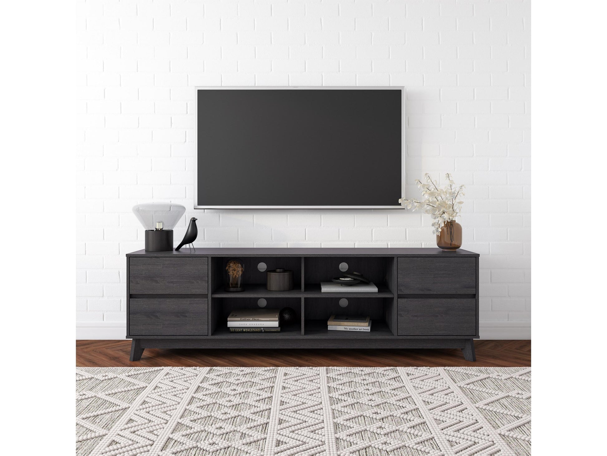 Grey modern TV stand for TVs up to 85 inches, featuring sleek lines, minimalist design, and ample storage with open shelves and cabinets. Made from durable wood with a smooth finish, perfect for contemporary living rooms.