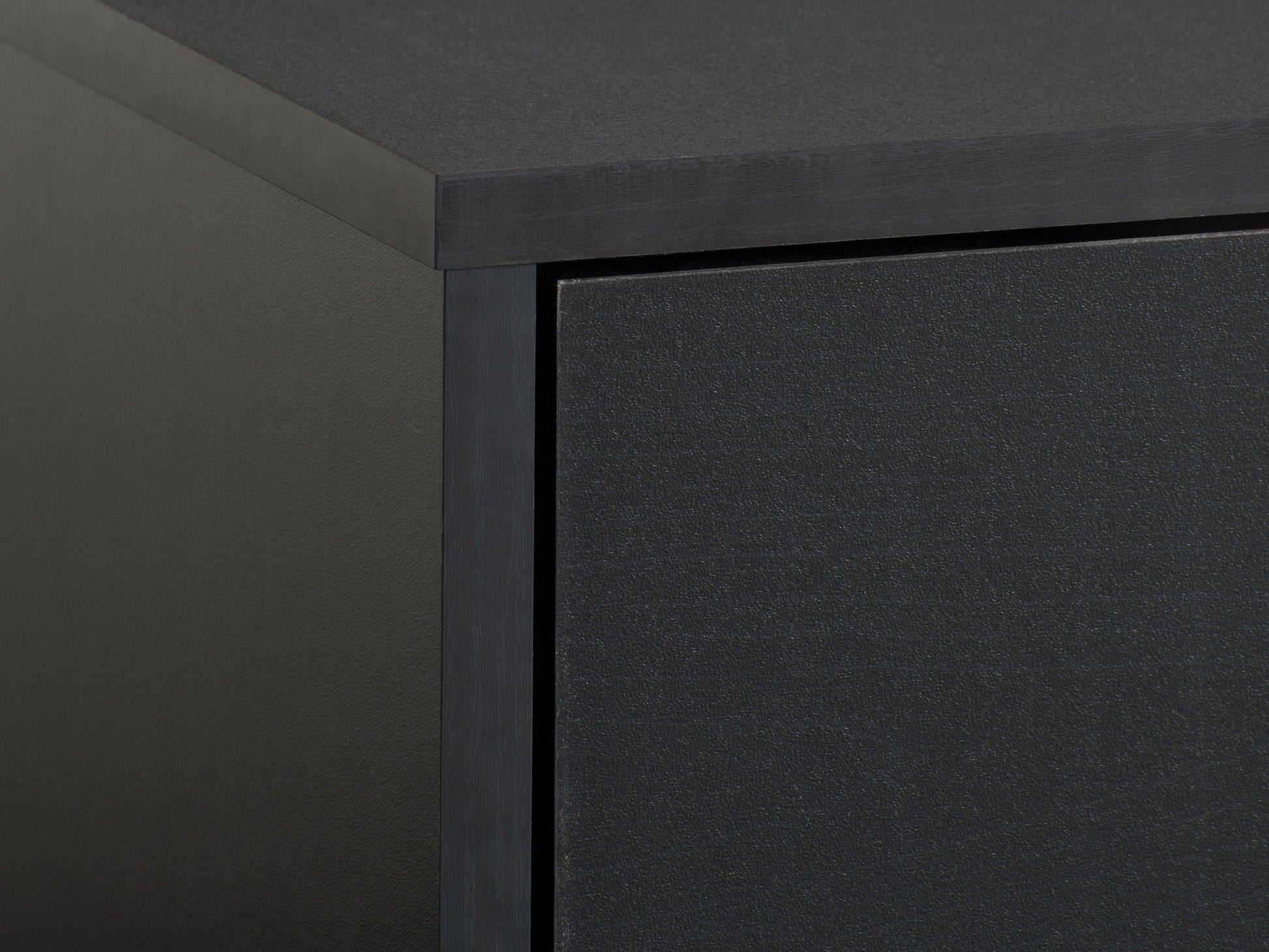 Modern black TV stand for TVs up to 85 inches, featuring sleek lines, minimalist design, and ample storage with open shelves and cabinets. Made of durable materials with a smooth finish.