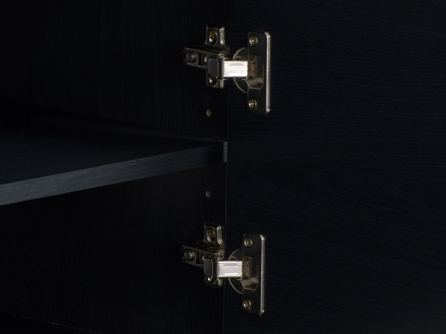 Modern black TV stand for TVs up to 85 inches, featuring sleek lines, minimalist design, and ample storage with open shelves and cabinets. Made of durable materials with a smooth finish.