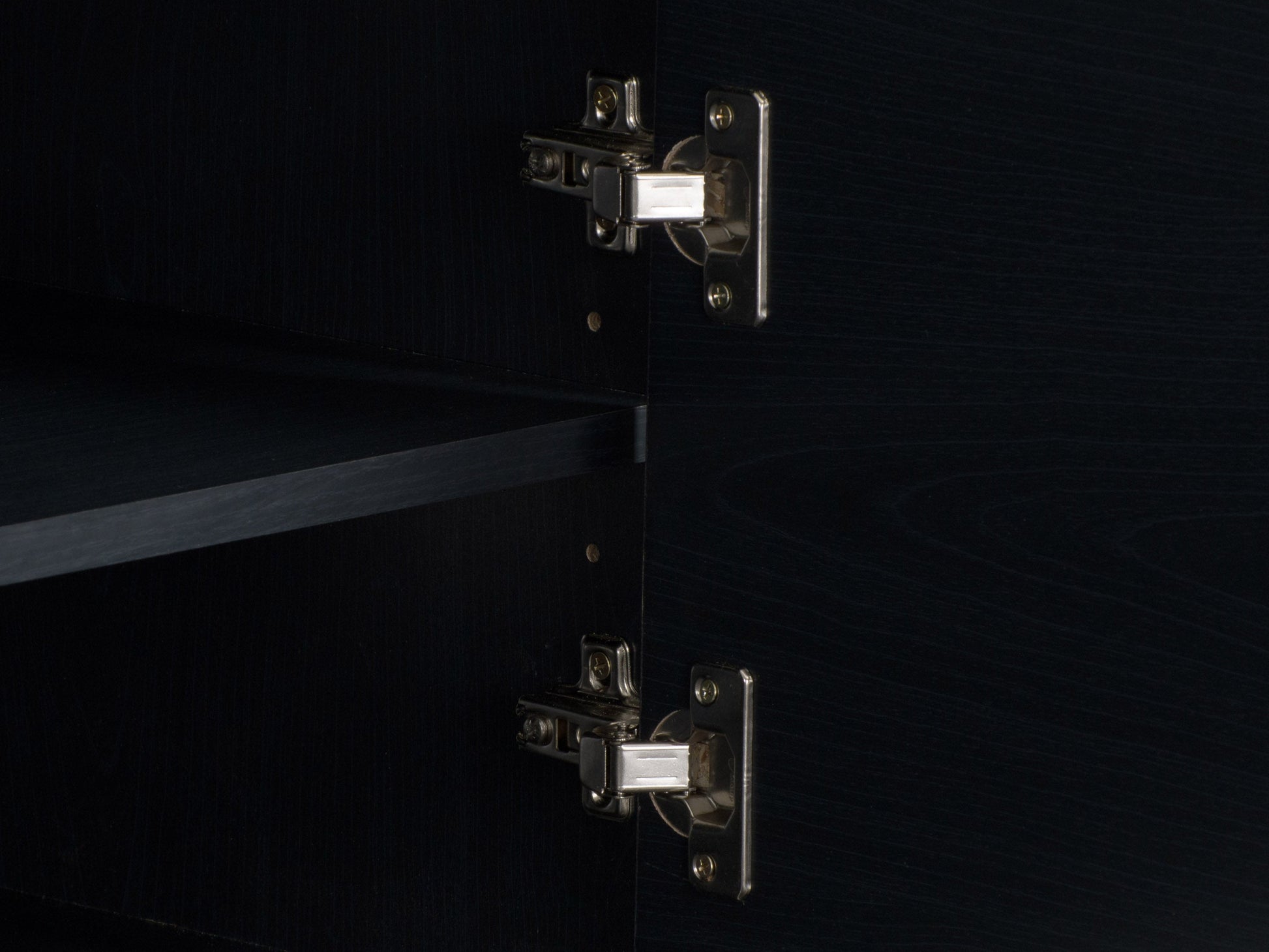 Modern black TV stand for TVs up to 85 inches, featuring sleek lines, minimalist design, and ample storage with open shelves and cabinets. Made of durable materials with a smooth finish.