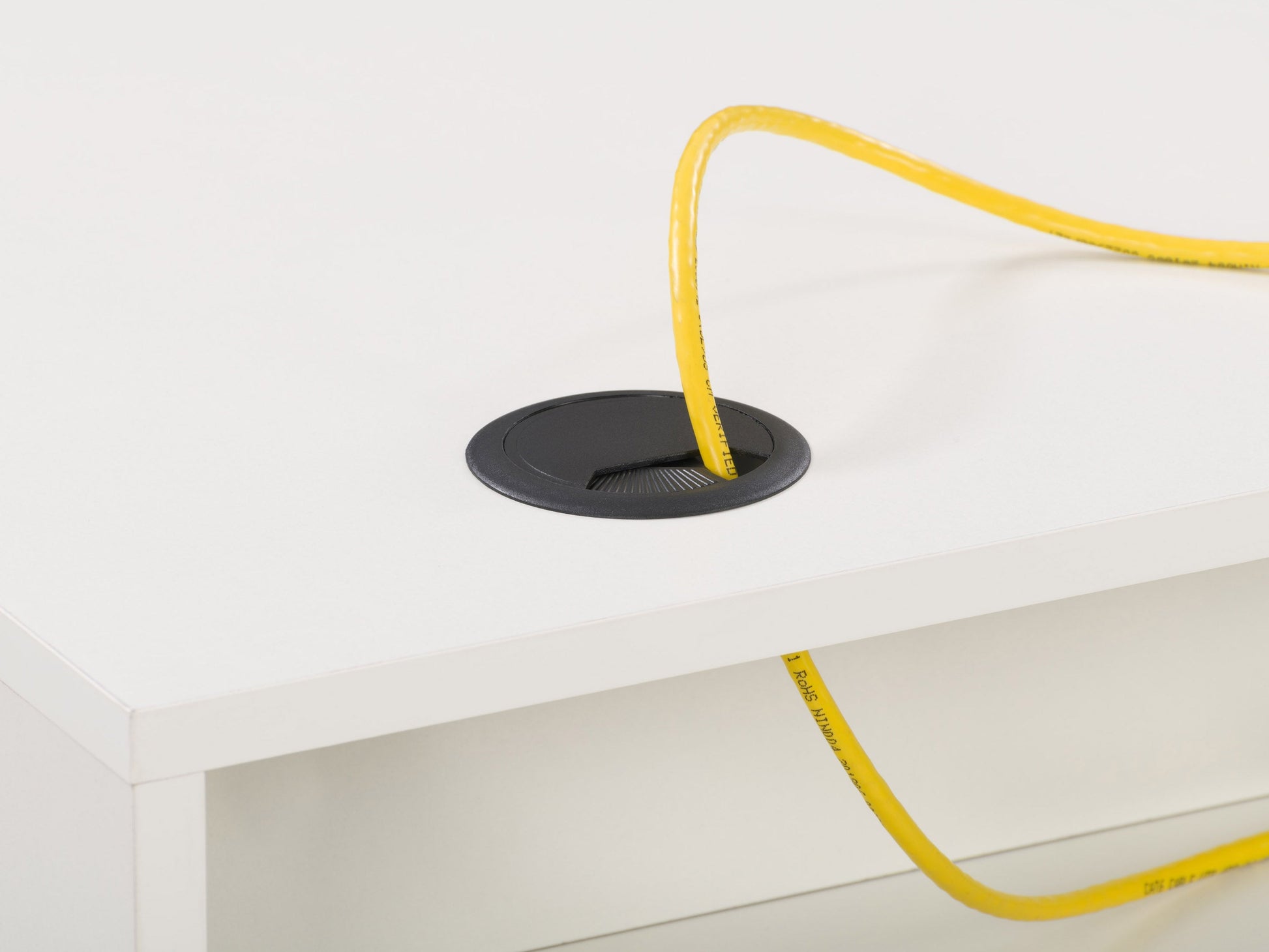 Modern white computer desk with sleek metal legs, spacious tabletop, built-in cable management, and minimalist design. Ideal for home office or study.