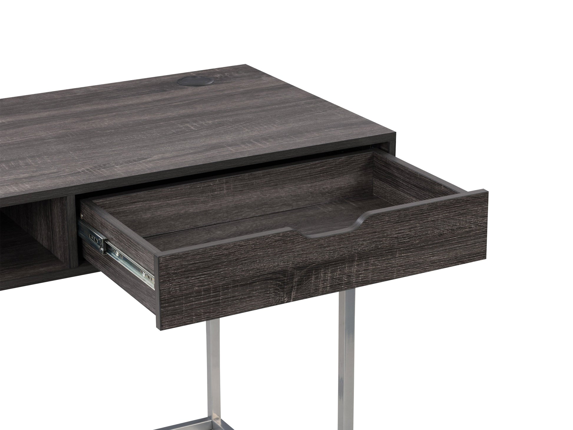 Sleek modern computer desk in grey with a smooth laminate surface, sturdy metal frame, and built-in cable management, ideal for home offices or workspaces.