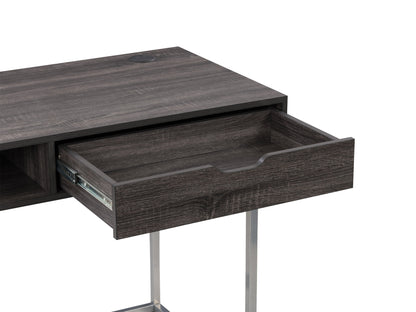 Sleek modern computer desk in grey with a smooth laminate surface, sturdy metal frame, and built-in cable management, ideal for home offices or workspaces.