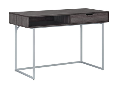 Sleek modern computer desk in grey with a smooth laminate surface, sturdy metal frame, and built-in cable management, ideal for home offices or workspaces.