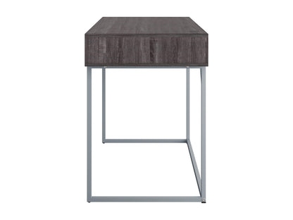 Sleek modern computer desk in grey with a smooth laminate surface, sturdy metal frame, and built-in cable management, ideal for home offices or workspaces.