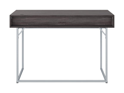 Sleek modern computer desk in grey with a smooth laminate surface, sturdy metal frame, and built-in cable management, ideal for home offices or workspaces.