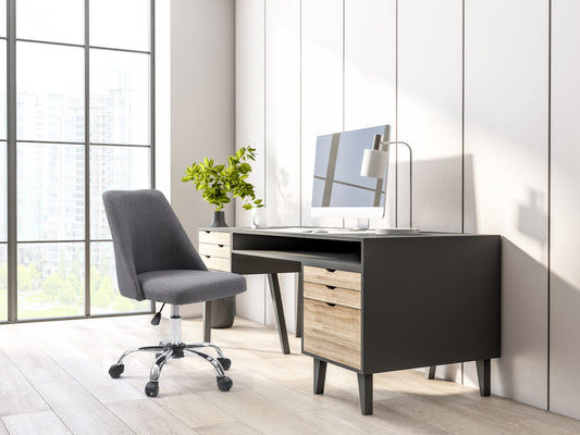 Dark grey armless task chair featuring a cushioned seat and backrest with sleek, modern design, perfect for office use. Upholstered in durable fabric, supported by a sturdy metal base with smooth-rolling casters.