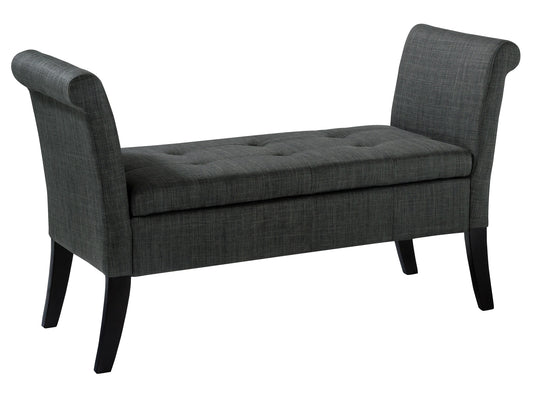 Gray upholstered storage bench with wooden legs, tufted seat, and armrests. Ideal for entryways or bedrooms, offering both seating and storage space. Modern design with neutral tones to match various decor styles.