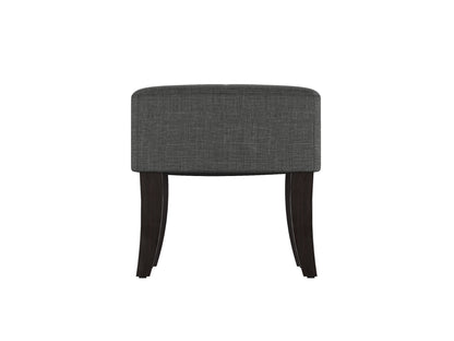 Gray upholstered bench with tufted seat, dark wooden legs, and sleek modern design. Ideal for living rooms or bedrooms.