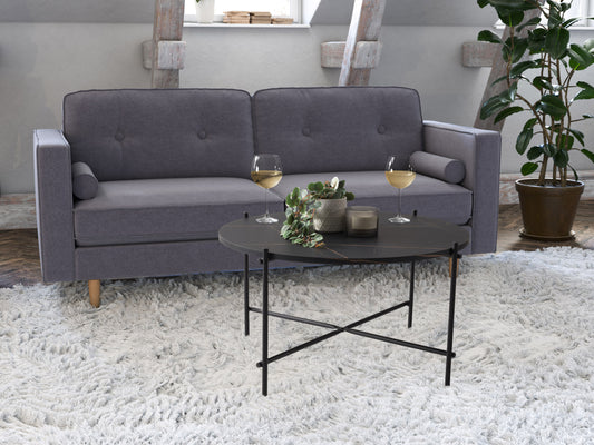 Black round coffee table with sleek metal frame, tempered glass top, and minimalist design, perfect for modern living rooms.