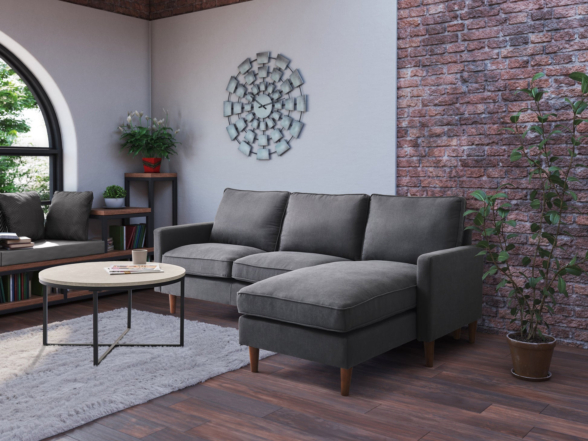 Reversible sectional sofa in light gray fabric with tufted cushions, chaise lounge on the right, and wooden legs, perfect for modern living rooms.