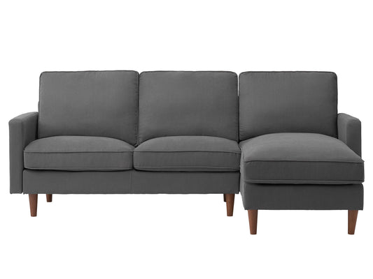 Gray reversible sectional sofa with plush cushions, sleek wooden legs, and a modern design, featuring a chaise lounge on the right side and durable fabric upholstery perfect for contemporary living rooms.