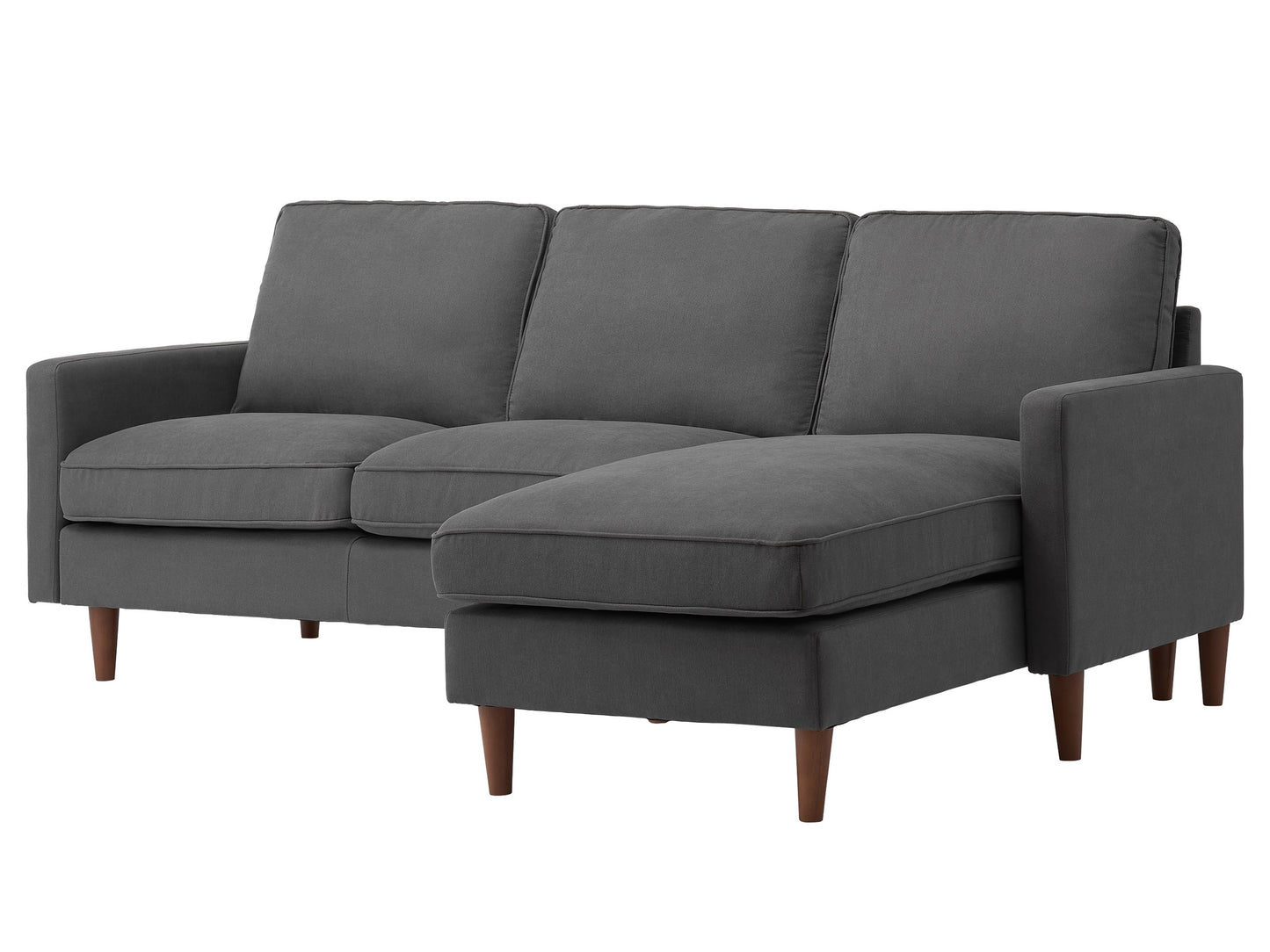 Reversible sectional sofa in light gray fabric with tufted cushions, chaise lounge, and wooden legs. Ideal for modern living rooms, offering comfort and flexibility in seating arrangements.