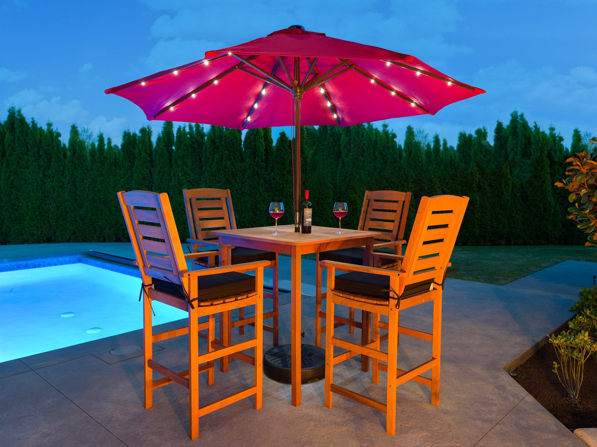 5-piece patio bar set with black metal frame, brown wicker accents, and beige cushions. Features a high-top bar table and four bar stools, perfect for outdoor dining and entertaining.
