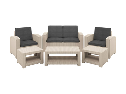 6 piece patio conversation set with gray wicker, navy blue cushions, and glass-top coffee table. Includes sofa, two armchairs, two ottomans, and a side table, perfect for outdoor lounging and entertaining.