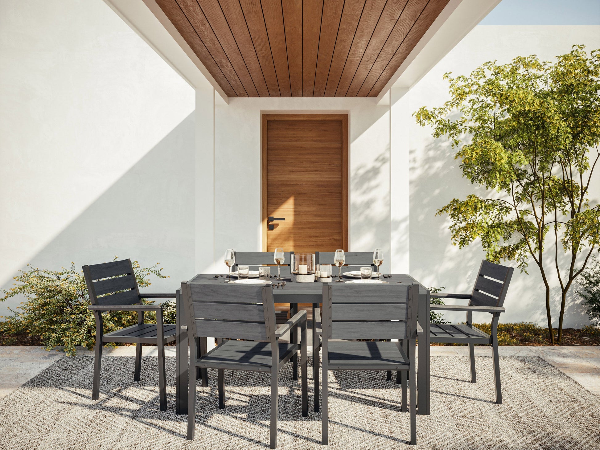 Modern outdoor patio dining set with six cushioned chairs and a rectangular wooden table, featuring a sleek black metal frame and weather-resistant materials, perfect for garden or backyard gatherings.