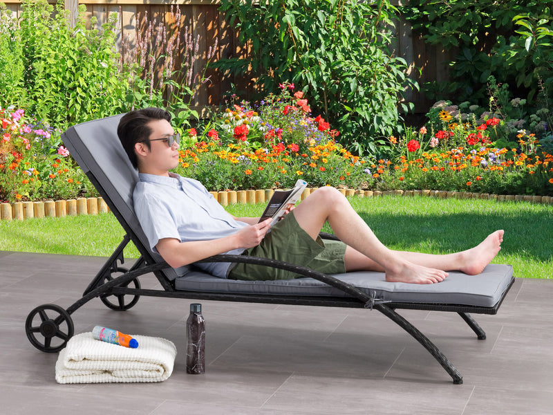 black and ash grey Outdoor Wicker Lounge Chair Parksville Collection lifestyle scene by CorLiving