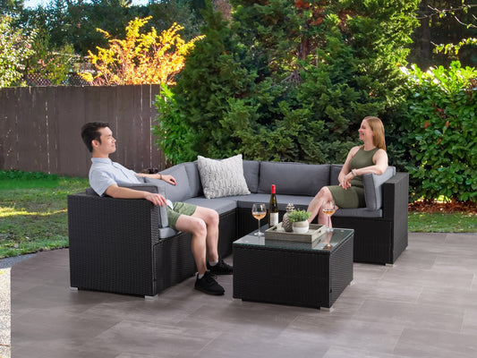 Outdoor patio sectional set, 6-piece, featuring gray cushions, brown wicker frame, includes corner and armless chairs, coffee table with glass top, perfect for garden or backyard lounging and entertaining.