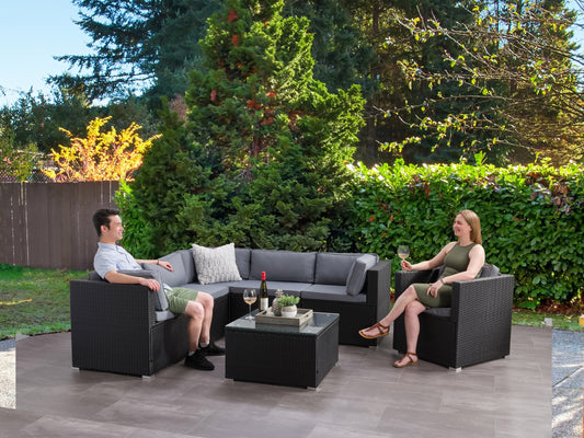 Outdoor sectional set, 7-piece patio furniture in grey wicker with blue cushions, featuring modular design, weather-resistant materials, and a glass-top coffee table, perfect for outdoor lounging and entertaining.
