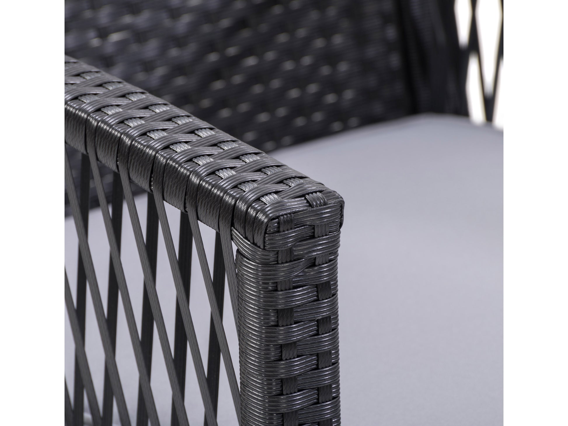 Modern 4-piece patio conversation set with dark wicker frame, beige cushions, glass-top coffee table, and durable outdoor materials, perfect for stylish and comfortable outdoor relaxation.