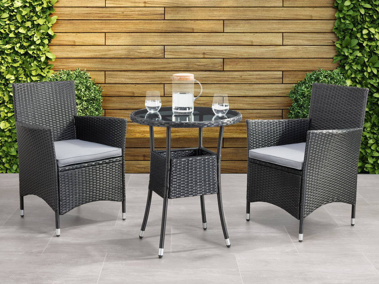 Modern 3-piece patio bistro set with a round glass-top table and two cushioned wicker chairs in beige and brown, featuring durable steel frames and weather-resistant materials ideal for outdoor dining.