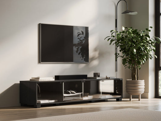 Sleek black glass TV stand with chrome legs, suitable for TVs up to 85 inches, featuring three tempered glass shelves for storage and cable management.