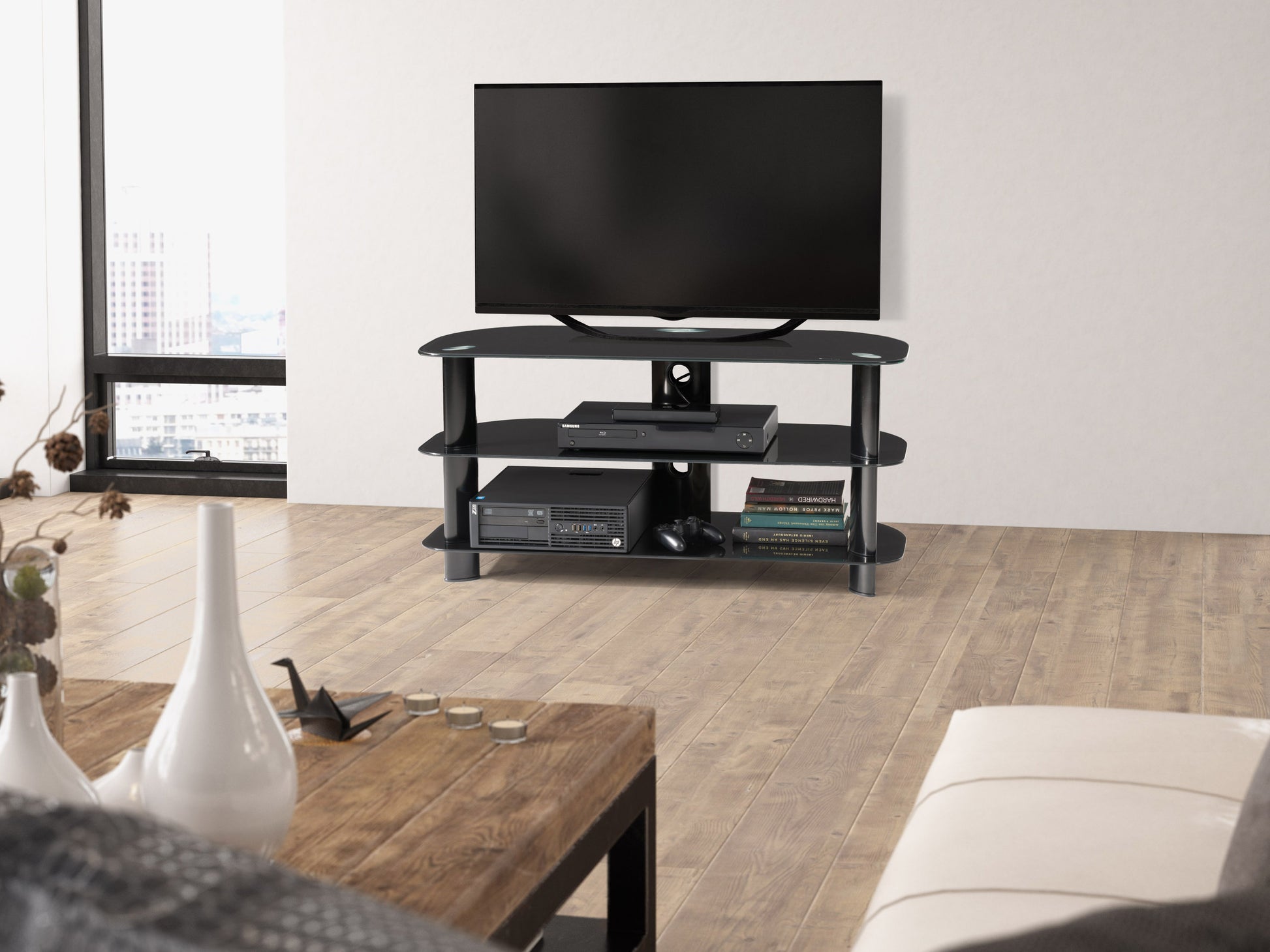 Black glass TV stand with three tempered glass shelves, sleek metal frame, and cable management system, suitable for TVs up to 48 inches. Modern design, perfect for living rooms and entertainment areas.
